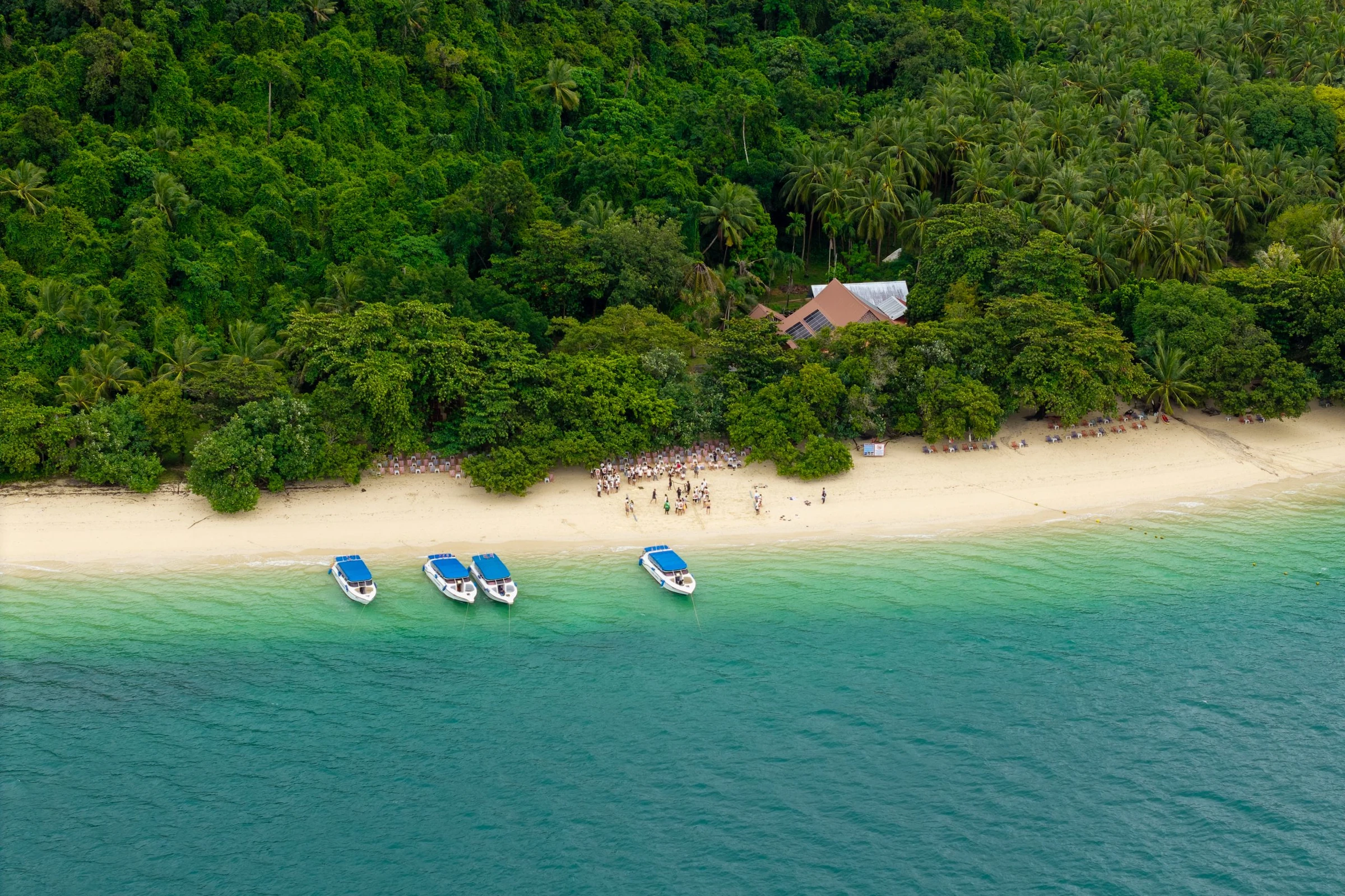 Boats moored at an island in Phuket for a teambuilding Island Hopping activity